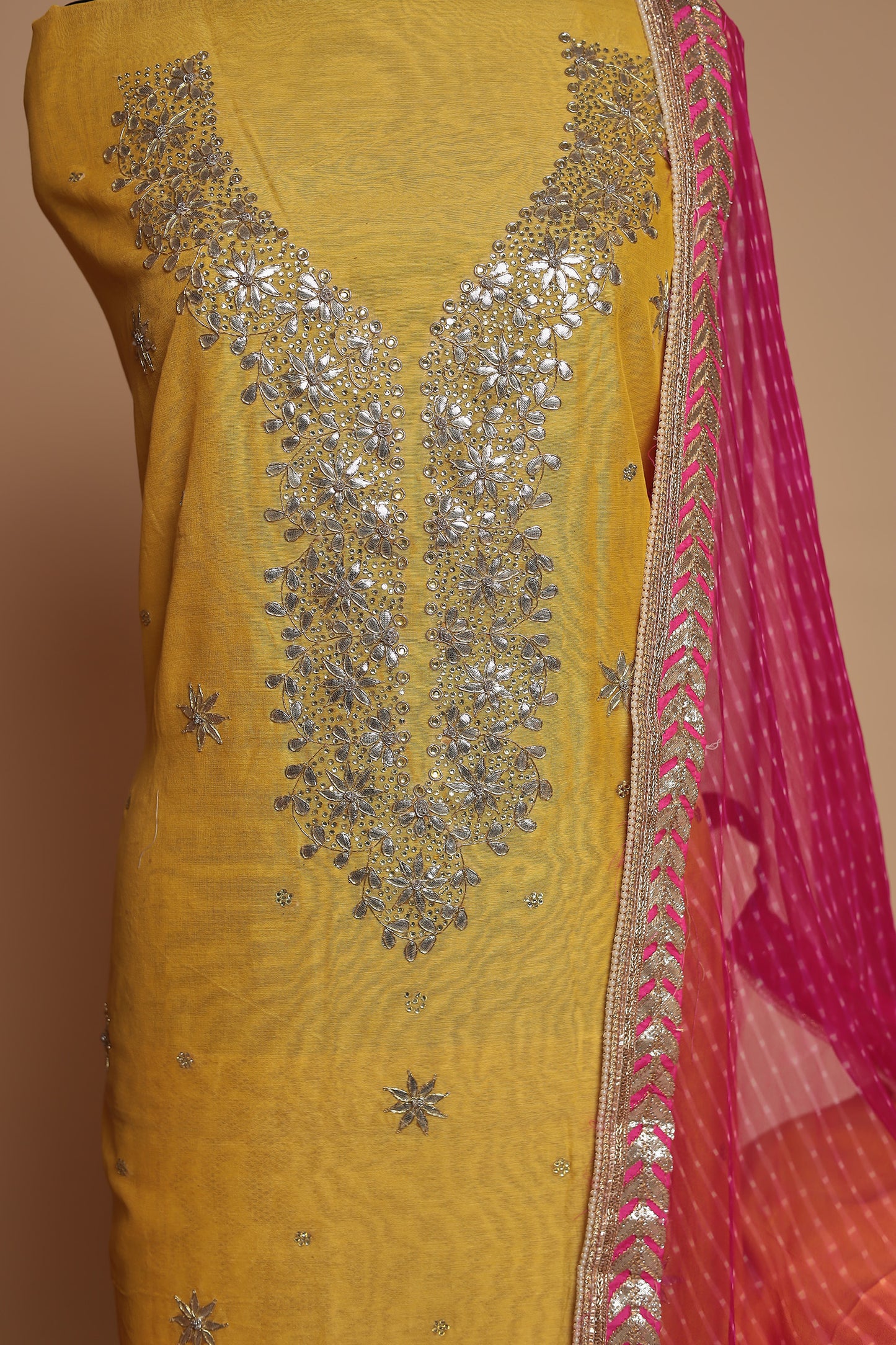 Vibrant Yellow Unstitched Suit with Heavy Silver Zari Work and Contrast Pink Dupatta