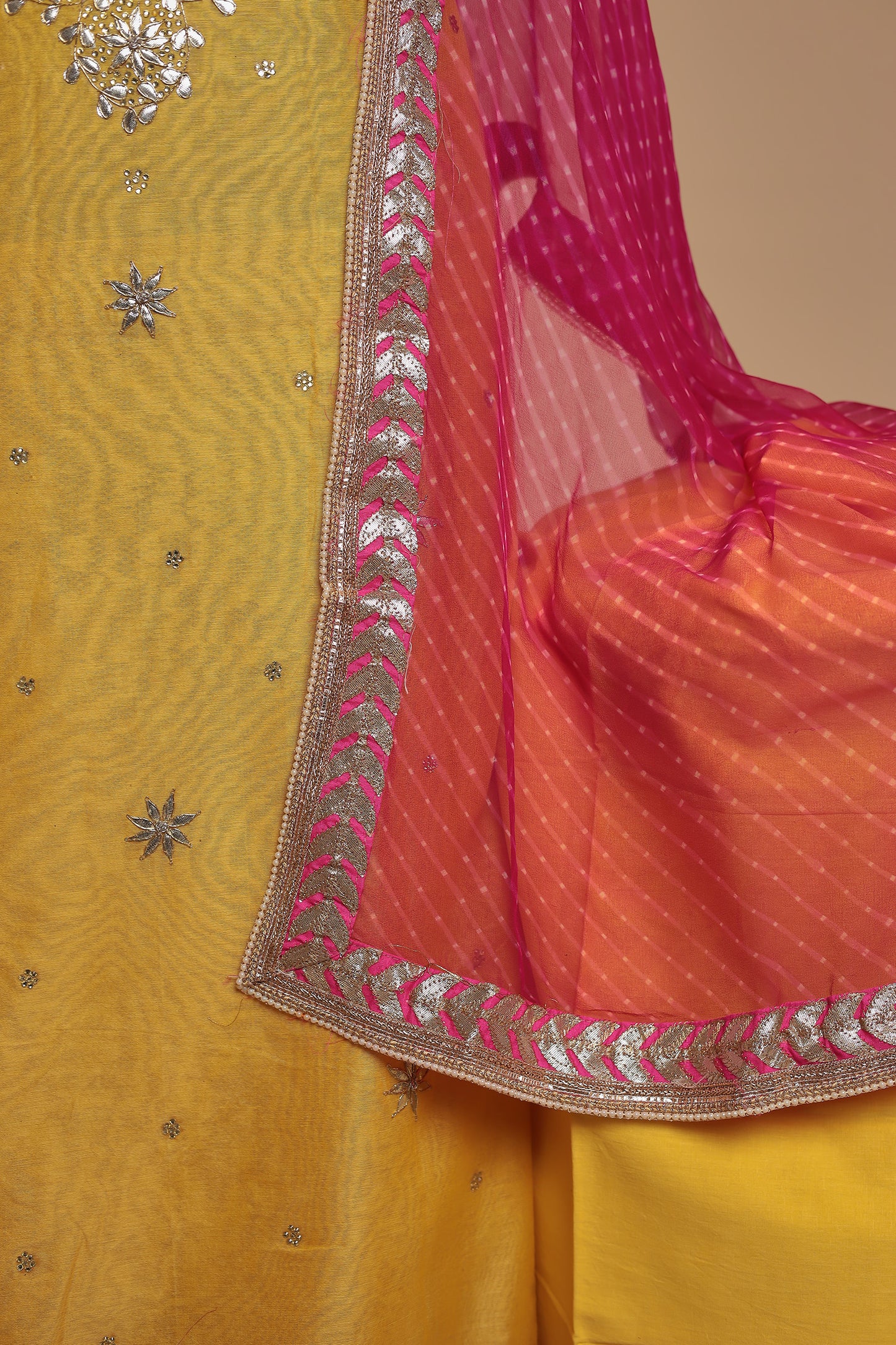 Vibrant Yellow Unstitched Suit with Heavy Silver Zari Work and Contrast Pink Dupatta