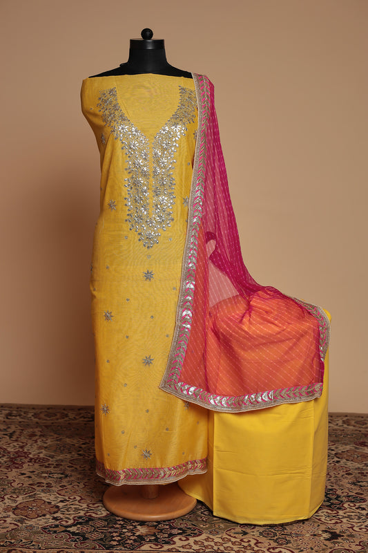 Vibrant Yellow Unstitched Suit with Heavy Silver Zari Work and Contrast Pink Dupatta