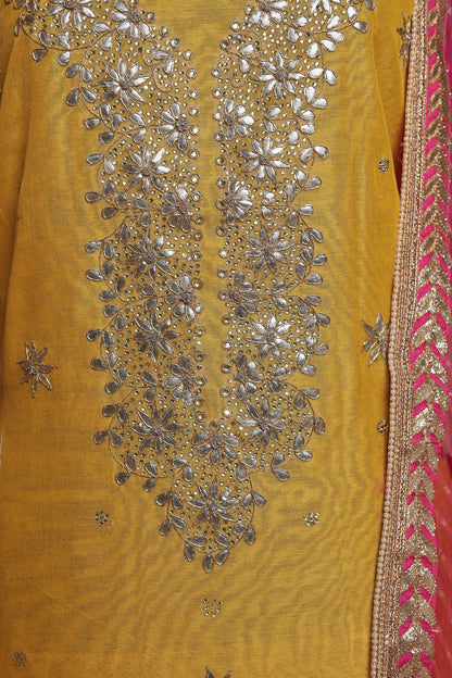 Vibrant Yellow Unstitched Suit with Heavy Silver Zari Work and Contrast Pink Dupatta